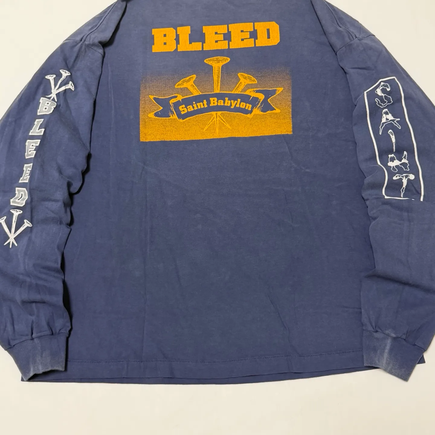 SAINT Mxxxxxx × BABYLON BBLN_LS TEE/SAINT BABYLON/NVY/BABYLON co-branded style Wolf head SAINT/nail distressed long sleeves Washed blue S-XL Completely matched Tube weaving fabric without side seams Garment dyeing Maliu water faded distressing Simulated sun fading treatment Natural fading Handmade holes and frayed Ink splashing treatment Correct main mark/wash mark/little angel anti-counterfeiting mark